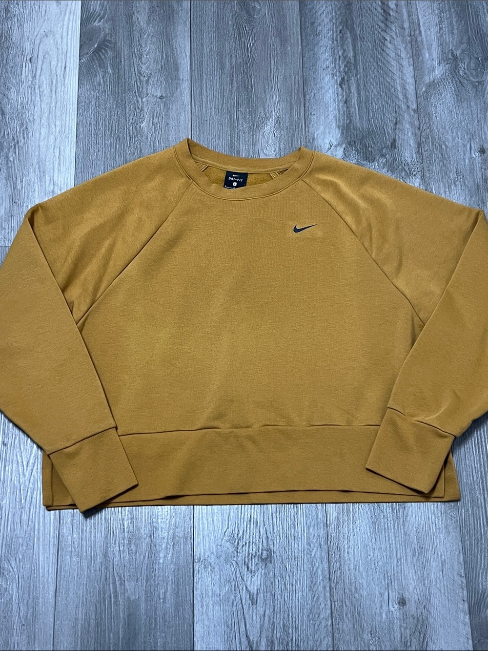 Nike woman’s cropped mutated yellow/ brownish sweater. / size L